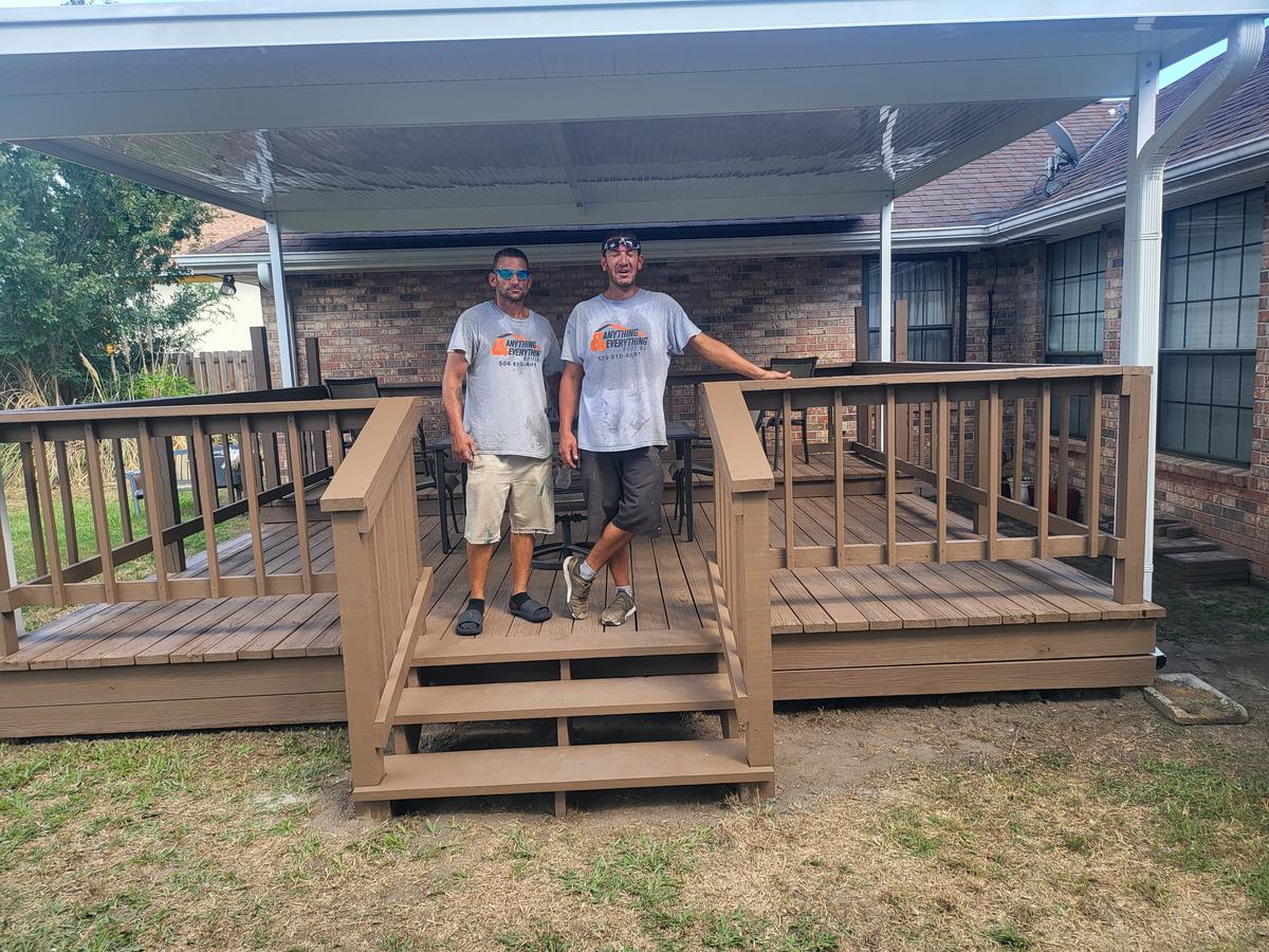 Our crew on a deck under a new white aluminum patio cover