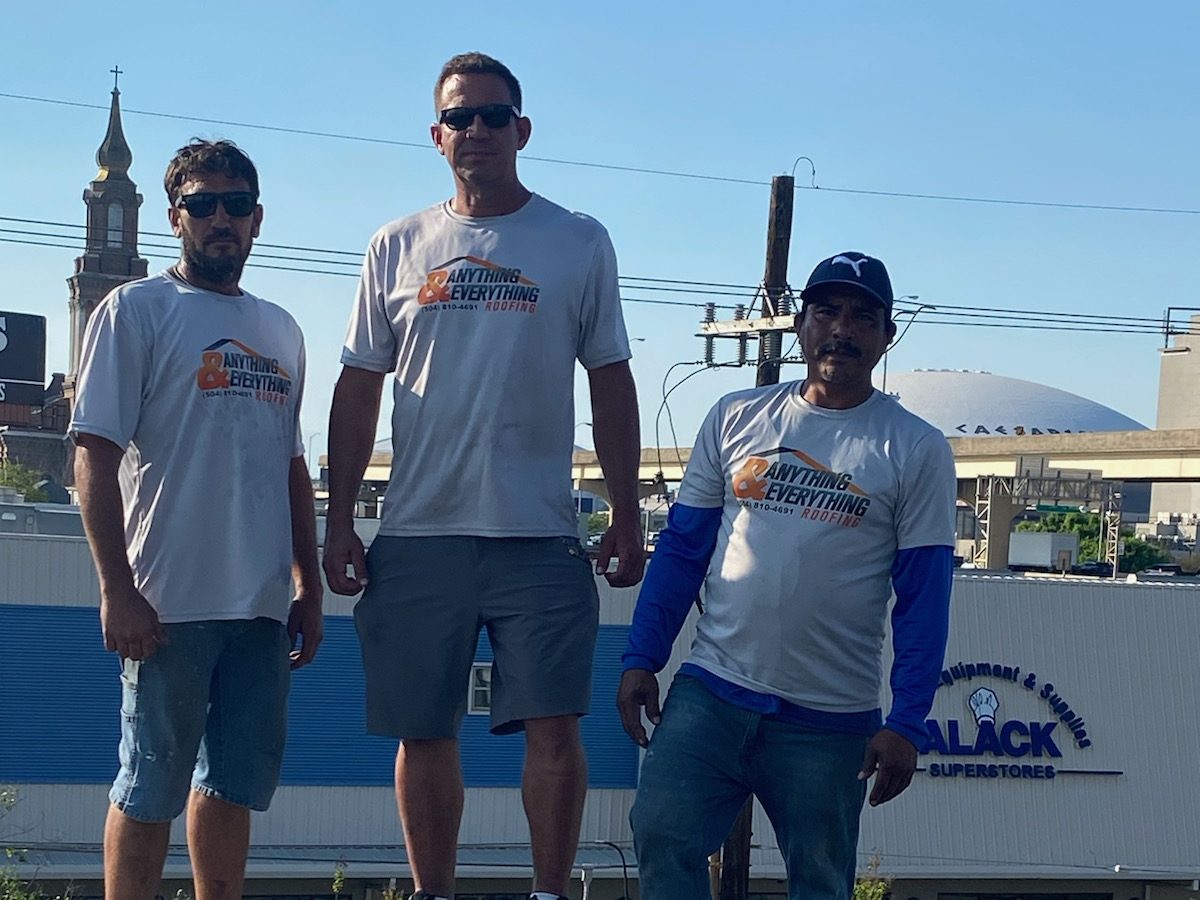 Anything and Everything Roofing crew on a shingle roof near the Caesars Superdome in New Orleans